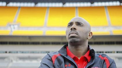 Gardner-Webb coach Ron Dickerson Jr. looks into the stands at Heinz Field on Friday afternoon as he leads his team through a walk-through of the stadium before today's game against Pitt.