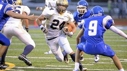 Kiski running back Jake Wiskerman tries to elude Hempfield's Jimmy Vaccare in the first half Friday at Hempfield.