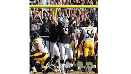 Raiders kicker Sebastian Janikowski celebrates after kicking the game-winning field goal in the final seconds to beat the Steelers.