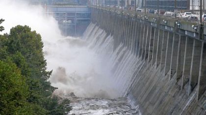 Water rushes through open bays on the Conowingo Dam on the Susquehanna River near Conowingo, Md. Scientists say harmful sediment is making its way through the dam into the Chesapeake Bay, threatening fish and wildlife in the watershed.