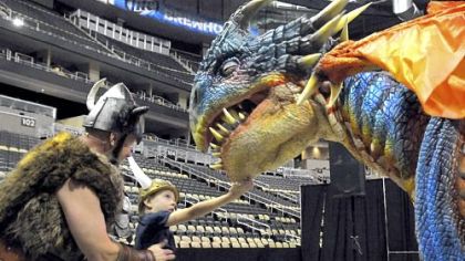 Sig the Viking shows Caden Suba, 8, of Franklin Park to find the "soft spot" of baby dragon Nadder at the "How to Train Your Dragon Live Spectacular" preview July at CONSOL Energy Center. The live show ran during the end of August.