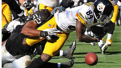 The Steelers' Antonio Brown loses control of the football as he crosses the goal line in the third quarter. He recovered the fumble for a touchdown.