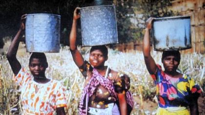 Aubrey Briggs' inspiration for his design, construction and financing a water system for a village in Malawi were the women such as these villagers there who spent their days carrying water on their heads.