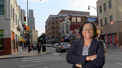 Paula Davis, the recently named Dignity & Respect Champion of Pittsburgh, poses for a portrait on Forbes Avenue in Oakland.