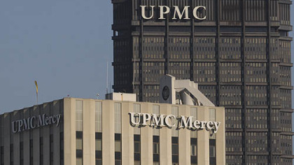 UPMC Mercy  pictured with the  UPMC letters atop of the U.S. Steel Tower in the background.