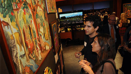 Luke Markiewicz and his sister Tonya Markiewicz look at Haitian art for sale.