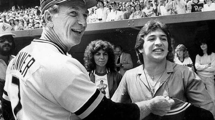 Lightweight boxing champion Ray "Boom Boom" Mancini receives a Pirates jersey from former Pirates manager Chuck Tanner in 1982 at Three Rivers Stadium.