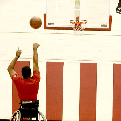 Wheelchair basketball player Trevon Jenifer shoots around at Edinboro University on Friday.