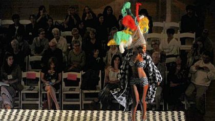 A model walks down the runway during the kickoff event of Pittsburgh Fashion Week, and eco-chic fashion show called "Green is the new black", held Monday at the Soldiers & Sailors Memorial Hall and Museum.