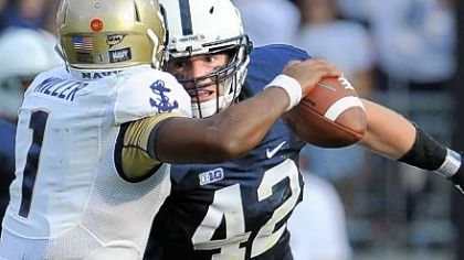 Linebacker Michael Mauti zeros in on Navy quarterback Trey Miller Saturday. He would later seal the win with a 74-yard return of a fumble in Penn State's 34-7 victory against the Midshipmen at Beaver Stadium.