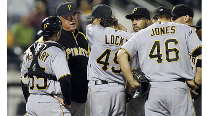 Pirates manager Clint Hurdle talks to starting pitcher Jeff Locke before removing him from the game in the fourth inning. Locke allowed five runs on nine hits in three and two-thirds innings.