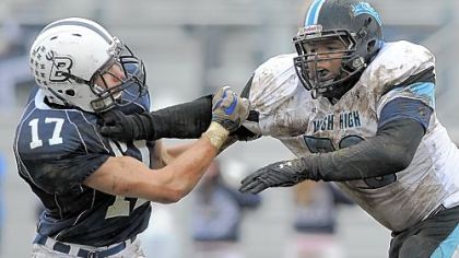 Senior lineman Rikwon Moore, right, going against Burgettstown's Joe Grayson in a game last season, plays a key role for undefeated Washington.