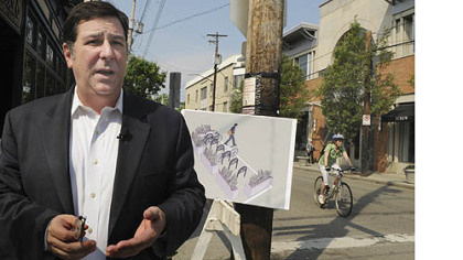 City Councilman Bill Peduto in August talked about the bike corrals -- cordoned-off areas where riders can park their bikes -- that are to be installed along Walnut Street in Shadyside.