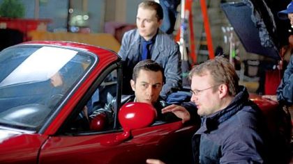 Rian Johnson, right, directs Joseph Gordon-Levitt on the set of "Looper."