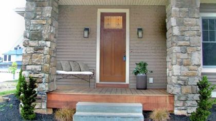The front entrance to Park Place -- Cranberry has stone columns and Brazilian walnut decking.