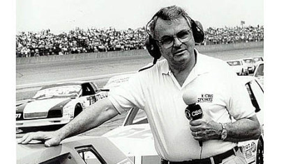 In an undated photo provided by CBS Sports, journalist Chris Economaki is shown at Daytona International Speedway in Daytona Beach, Fla. Mr. Economaki, regarded as the authoritative voice in motor sports for decades, died Friday.