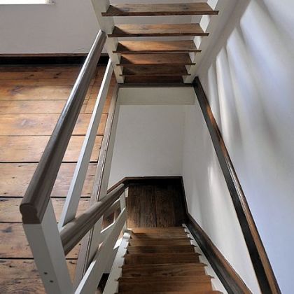 Restored open stairway in Church Street home.