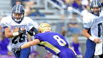 Rochester's Dante Marsick (#28) tries to get around Western Beaver's Holava Creston (8) Saturday in a game at Western Beaver High School.