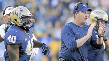 Pitt's Dan Mason watches next to head coach Paul Chryst after his team recovered a fumble against Gardner-Webb in the fourth quarter.