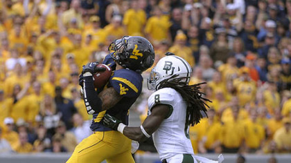 West Virginia's Stedman Bailey hauls in a 47-yard touchdown pass in front of Baylor's K.J. Morton in the second quarter. It was the first of five touchdown passes he would catch to go with 303 yards receiving.