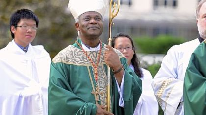 Cardinal Peter Turkson takes part in a processional for Mass at Duquesne University's Chapel of the Holy Spirit on Saturday.