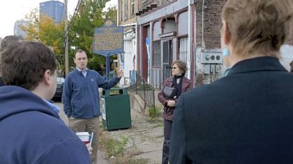 Kevin Acklin, executive director of RenewPittsburgh, speaks to a crowd during a special program, "August Wilson: His House History and Yours" on Saturday in the Hill District.