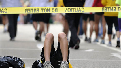 Tyler Pollock, 14, of Moon Twp., takes a rest as he reserves a spot for his family at the starting line of the Great Race.