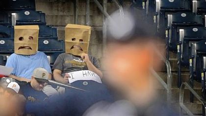 Pirates fans show their frustration Monday at PNC Park with the team's 20th consecutive losing season.