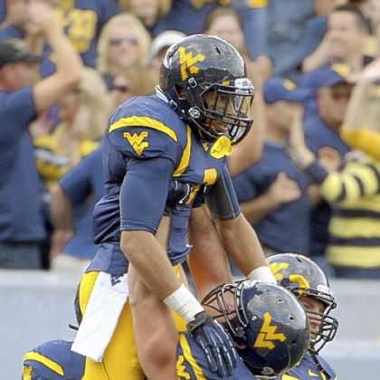 West Virginia wide receiver Stedman Bailey celebrates with his teammates in the fourth quarter of Saturday's 70-63 victory against Baylor.