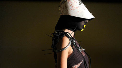 A model wears accessories and refuse-inspired apparel by Faith Pongracz of Faith n' Khaos at the Pittsburgh Fashion Week kickoff show at Soldiers & Sailors Memorial Hall and Museum in Oakland.