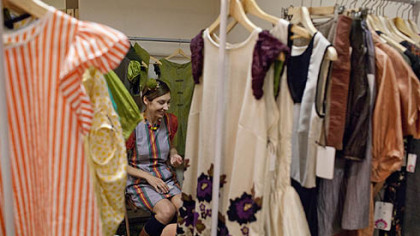 Monika Gibson, owner of the line Zuza Blue, sits in her booth at the Fashion Ave. Vendors Fair.