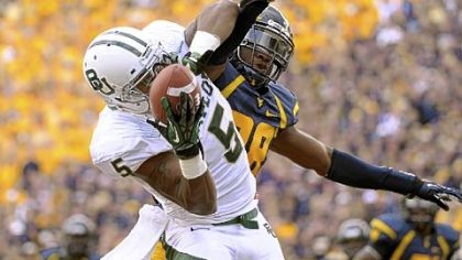 West Virginia's Terence Garvin, right, and the rest of the Mountaineers defense is trying to forget Baylor's 63-point output Saturday as they prepare to face Texas this week.