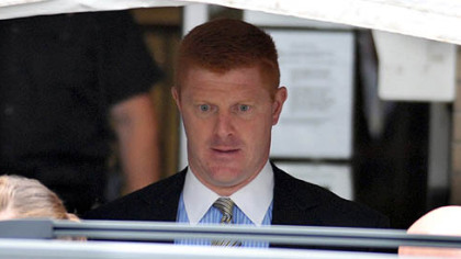 Mike McQueary, a Penn State assistant football coach who is currently on leave, exits the Centre County Courthouse on June 12, 2012 after testifying for two hours.