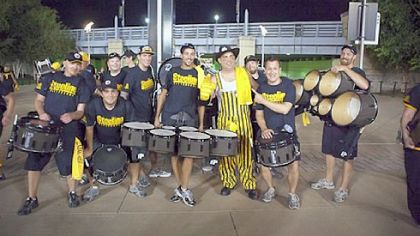 The Steeline posing with some fans after a performance.