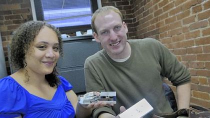 Hahna Alexander and Matt Stanton display their project, Sole Power, which charges a cell phone by walking.