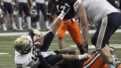 Quarterback Tino Sunseri is sacked by Syracuse's Brandon Sharpe during the first quarter Friday night in Syracuse, N.Y.