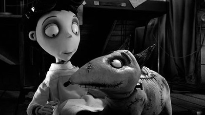 Victor happily examines his beloved dog, Sparky, after he successfully brings him back to life in "Frankenweenie."