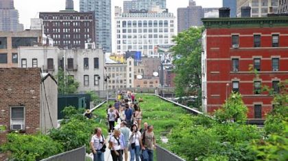 Visitors walk on New York's High Line, a public park that has been constructed on the remains of an abandoned elevated railroad in the Chelsea neighborhood of Manhattan.