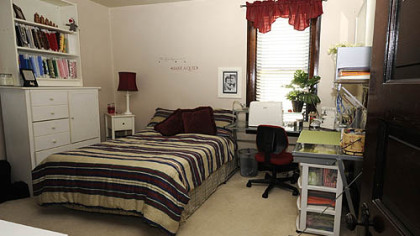 The bedroom is used as a combination guest room and sewing room.