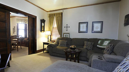 The living room and dining room can be separated by oak pocket doors.