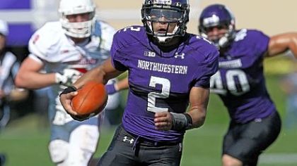 Jonathan Daniel/Getty Images
Northwestern's Kain Colter runs for his fourth touchdown of the game against Indiana Sept. 29 in Evanston, Ill. Northwestern defeated Indiana, 44-29.