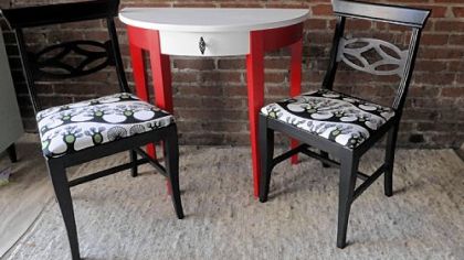 Dressing table in red and white with tree chairs.