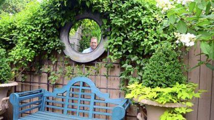 Ron Kotcho in the Squirrel Hill garden he designed.
