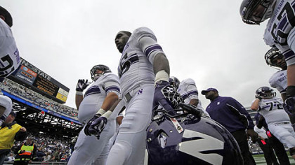The Northwestern football team heads to the locker room after warming up before today's game against Penn State in State College.