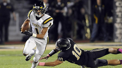 North Allegheny's Brendan Coniker gets by Gateway's Mileak Ford Friday night at Gateway High School.