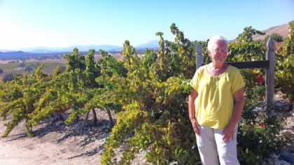 Paula Getzelman stands by the vineyard she and her husband planted a decade ago beside their home near Lockwood, Calif. She is one of several southern Monterey County residents concerned that shale drilling in the region could jeopardize the region's burgeoning wine industry.