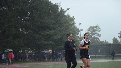 Pittsburgh Police Officer Colleen Bristow runs with her daughter, Laurel, 12, after her track meet Thursday in Schenley Park. Officer Bristow was injured in an on-the-job incident on the North Side in September 2010.  Until recently, running was made impossible by her injuries.