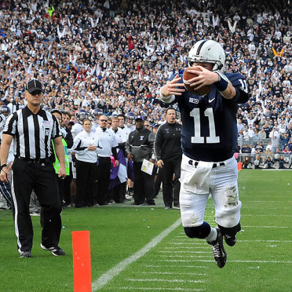 Penn State quarterback Matt McGloin leaps into the end zone scoring the game-winning touchdown against Northwestern in today's game at State College.
