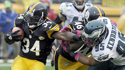 Rashard Mendenhall pushes away from the Eagles' Mychal Kendricks in the third quarter Sunday at Heinz Field.