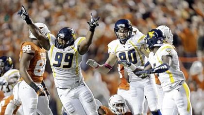Desmond Jackson (99) and West Virginia stopped Texas when it mattered most Saturday in Austin, Texas.